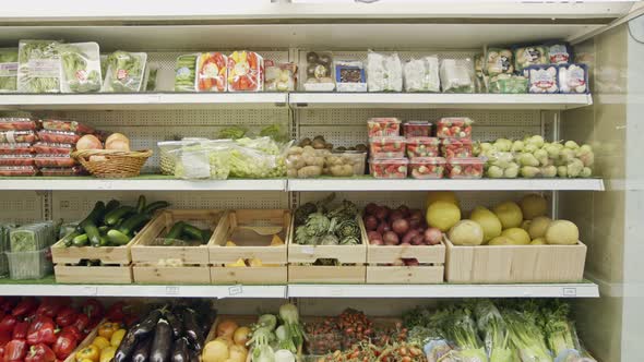 Large variety of vegetables and fruits on a supermarket shelves