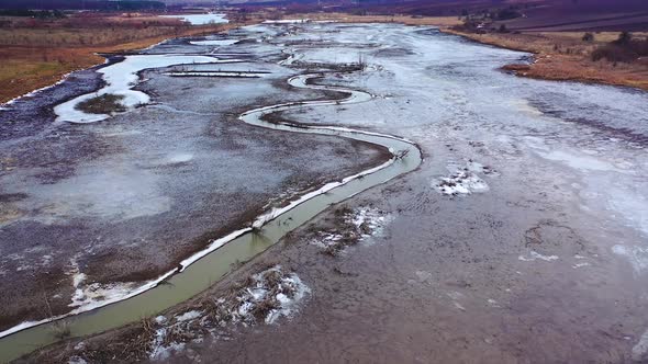 Narrow dirty river. Ecological problems with water. 