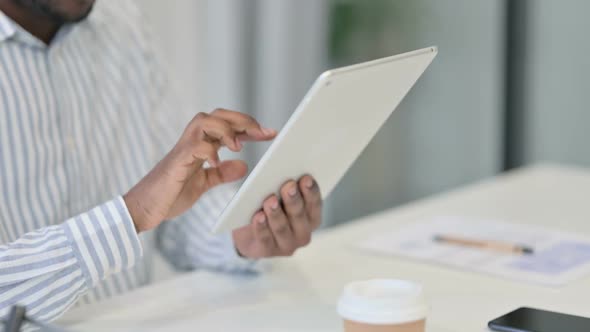 Close Up of African Man Using Digital Tablet
