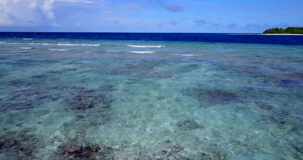 Luxury overhead copy space shot of a white sandy paradise beach and aqua turquoise water background 