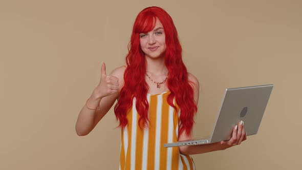 Redhead Girl Working Online on Laptop Showing Thumb Up Positive Good Feedback Like Lottery Win