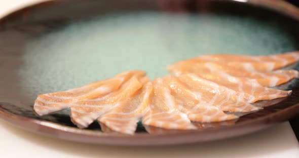 Plating Fresh Salmon Meat Sliced Thinly - Sashimi Preparation - close up tracking shot