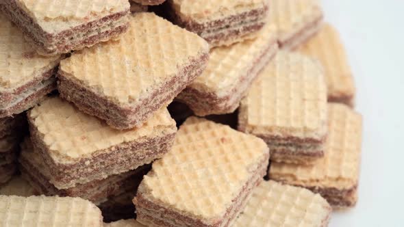 Spinning Pile of Square Wafer Biscuits