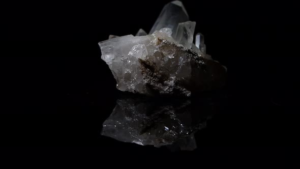 Ghostly quartz crystals with the large one having incredible clarity.  a subtle reflection in the gl
