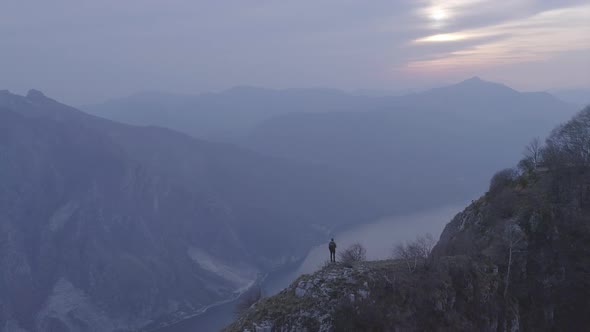 Hiker standing on viewpoint at Lake Como, Lombardy, Italy