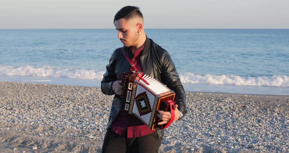 Playing Accordion on the Beach