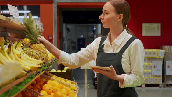 Store Manager Checks Fruits Condition in Store Closeup