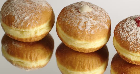 Donut With Jam Sprinkled With Powdered Sugar