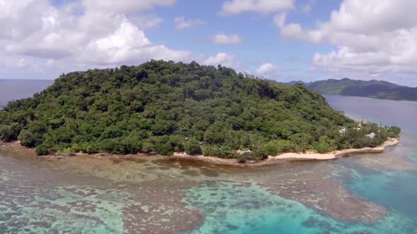 Aerial drone view of a scenic tropical island in Fiji.