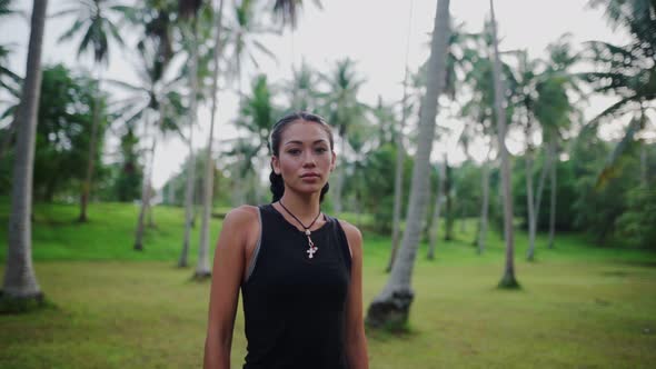 Asian Woman Meditating in the Jungle