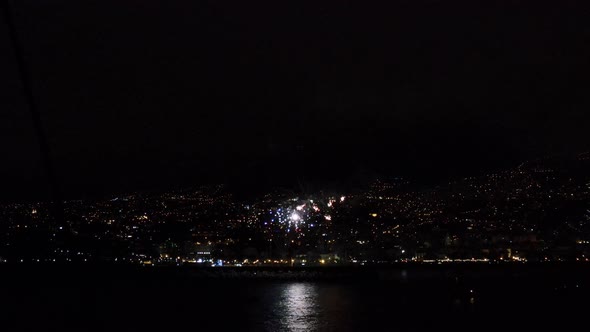 Stunning drone view of fireworks at the shore of Funchal city in Madeira, Portugal.