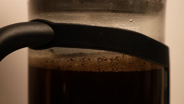 Close up of mixing instant coffee prepared from granules and heated water.