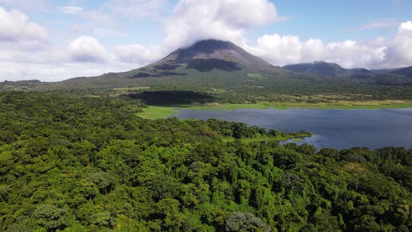 Trucking cameraement in aerial footage of Costa Rica's youngest and most active volcano. Big clouds