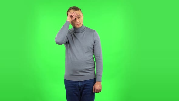 Male Is Tired and Sighs. Green Screen