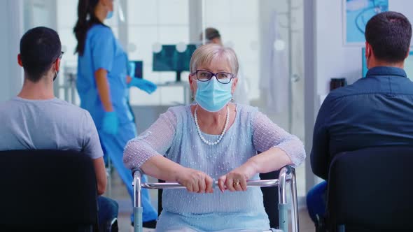 Portrait of Disabled Senior Woman with Walking Frame