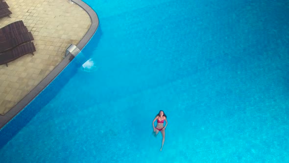 Girl Floating on Pool