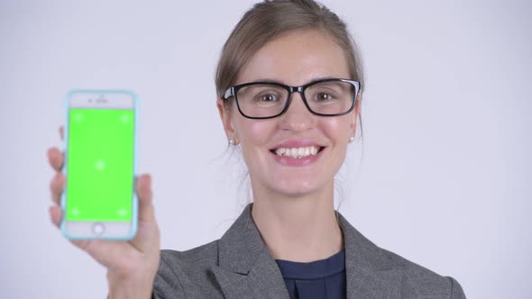 Face of Young Happy Businesswoman Showing Phone