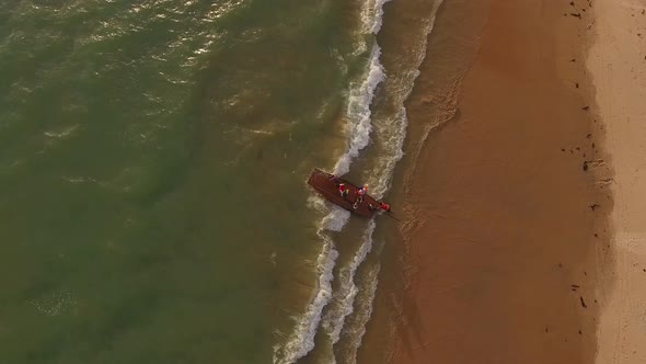 Aerial view of fishmongers in Jangadas, small traditional boats on the beach.