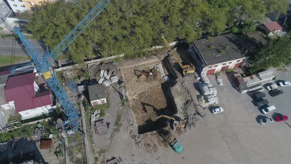 Aerial of excavators digging a foundation