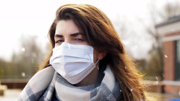 Woman Wearing Protective Medical Mask in Winter