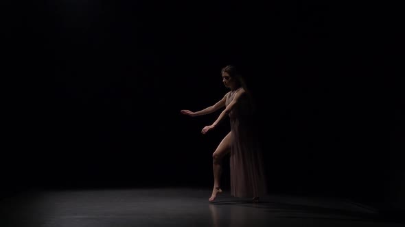 Slow Motion of Sporty Maiden Dancing Contemp in Dark Studio