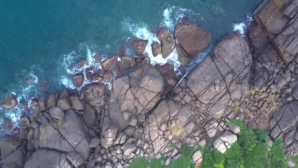 Nature with Waving Turquoise Ocean and Huge Grey Stones