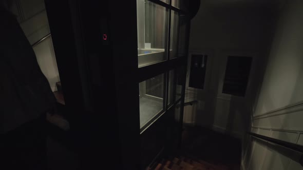 Woman getting upstairs using elevator