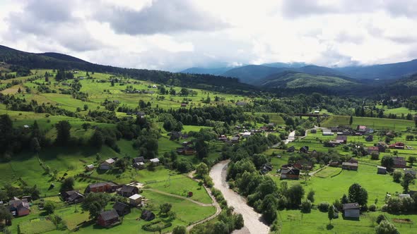 Mountains Village Landscape with River and Beautiful Vintage Wooden Houses