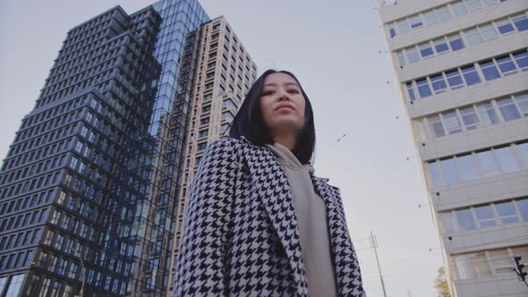 Lowangle Portrait of a Young Adult Asian Woman in Downtown District