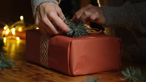 Hands Decorates Christmas Present