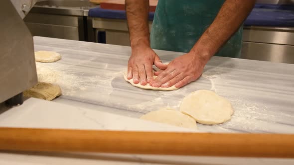 Hands of Arab Male Kneading Pizza Dough