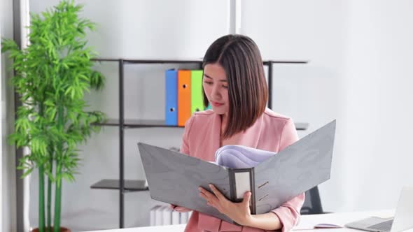 Young Asian business  woman  in office face portrait smile happy.