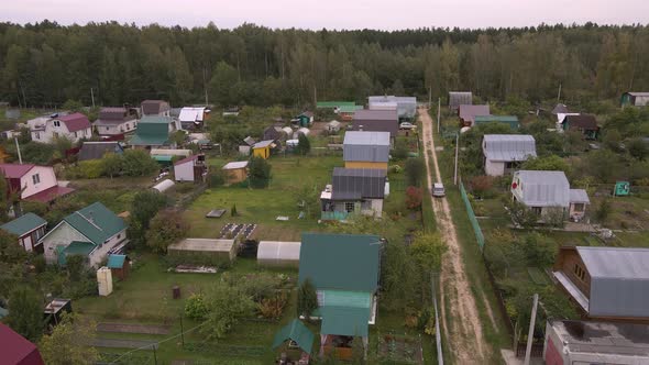 Aerial View of the Countryside with Small Garden Houses