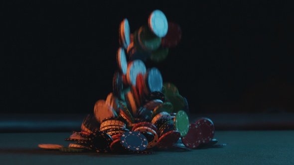 Casino Poker Chips Crashing on a Table in Slow Motion
