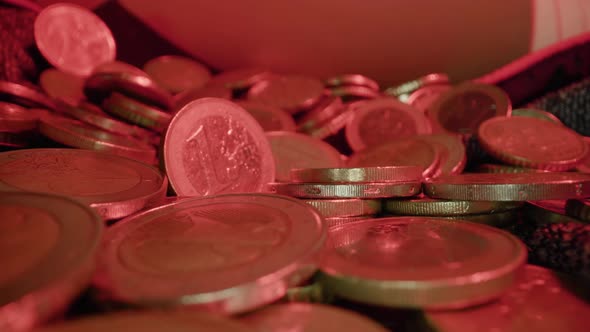 Motion Over Scattered Golden Euro Coins on Fabric Sheet