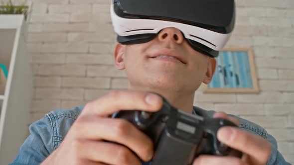 Man Playing Games in VR Headset