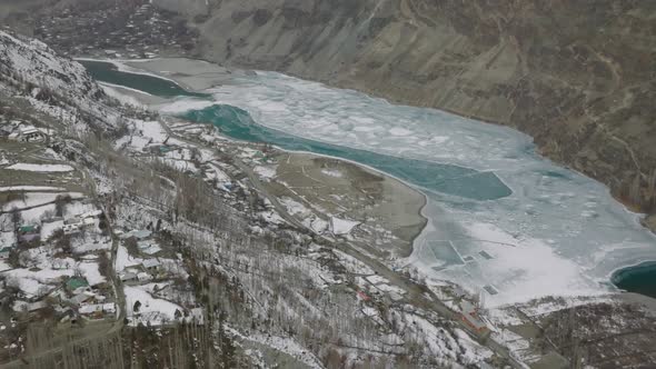 Cinematic Aerial View Of Frozen Khalti Lake In Gupis-Yasin Valley. Aerial Flying Over Frozen khalti