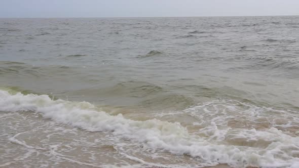 Wave Breaking Over Blue Swells Crashing Curling a Surface