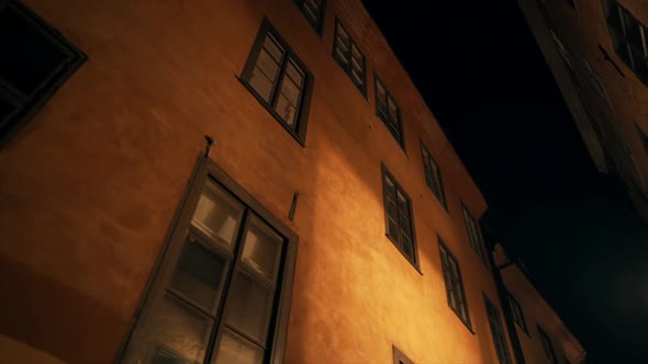 Apartment Buildings on European Night Streets in Old City. Scandinavian Windows.