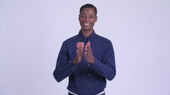 Young Happy African Businessman Clapping Hands