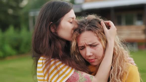 Woman Becalm or Console a Victim of Domestic Violence. Woman with a Scar on Her Face Crying and