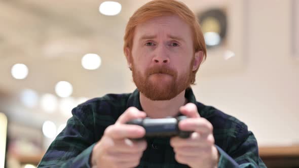 Beard Redhead Man Playing Video Game 