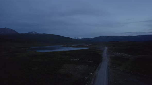 Aerial view on lakes and mountains with dramatic sky in Altai