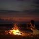 Mysterious Woman Dancing Around Cozy Fireplace on the Beach After the Sunset Twilight Festival Event - VideoHive Item for Sale