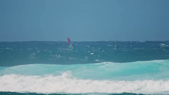Kite Surfer Riding Green Ocean Waves with Sprays on Hawaii Coast Slow Motion