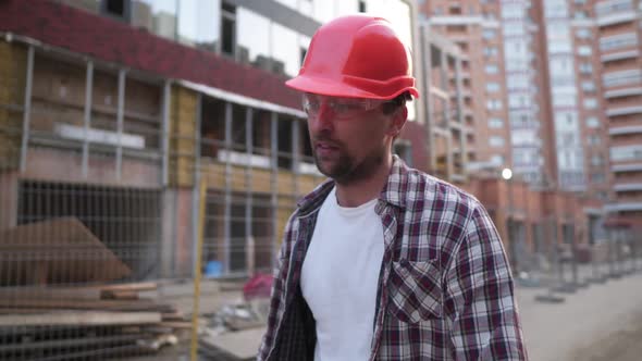 Young Caucasian Angry Construction Worker Shouting at Construction Site