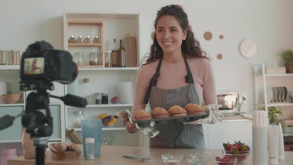 Female Blogger Smelling Freshly Baked Muffins