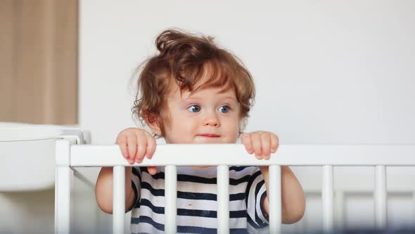 Toddler boy in bed in room