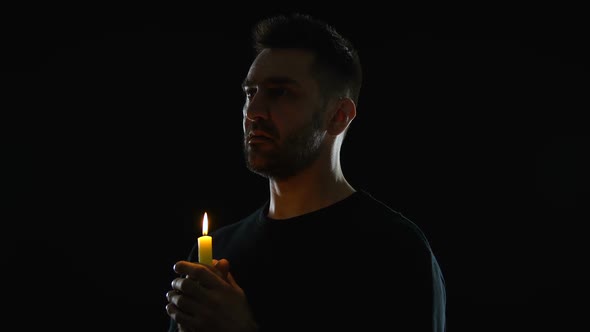 Praying Male Looking at Burning Candle Hands, Spiritual Support, Memorial Ritual