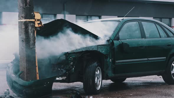 Smoke From Wrecked Car with Fire Engine in the Background. Car Accident